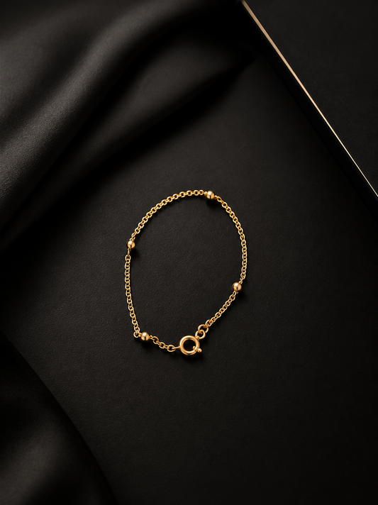 Pulseira batida e bolas ocas , em ouro Ourivesaria Carlos Alberto