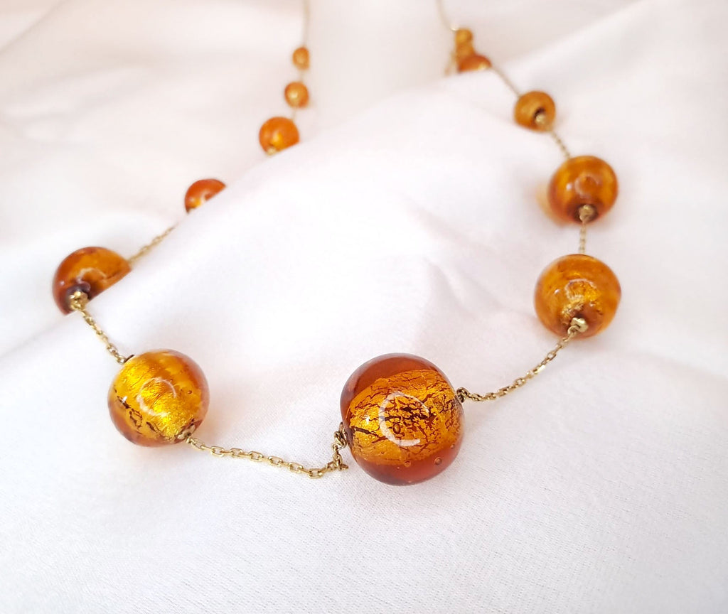 Volta com  bolas de resina Ourivesaria Carlos Alberto