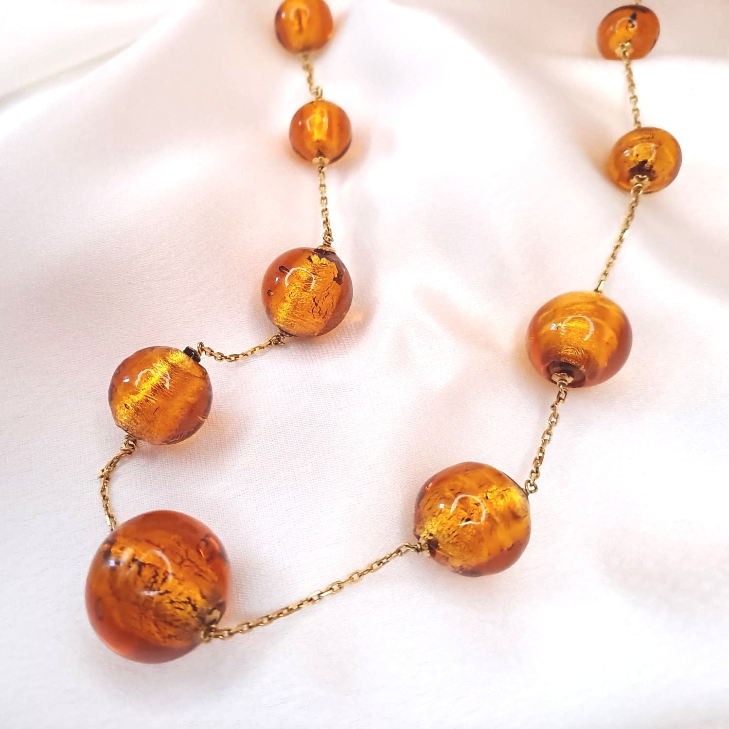 Volta com  bolas de resina Ourivesaria Carlos Alberto