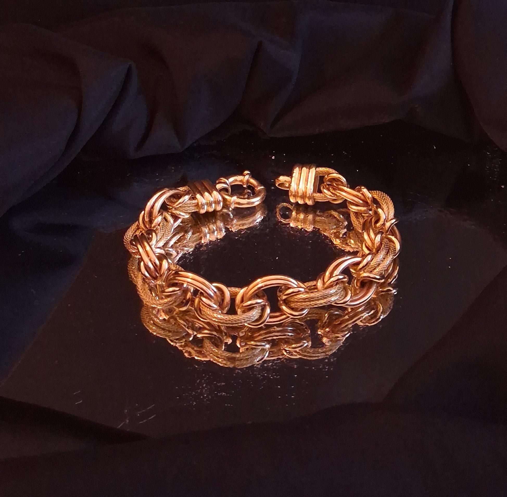 Pulseira de elos polidos e rugosos , em ouro Ourivesaria Carlos Alberto