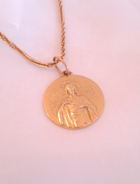 Medalha redonda com Cristo em relevo , em ouro Ourivesaria Carlos Alberto